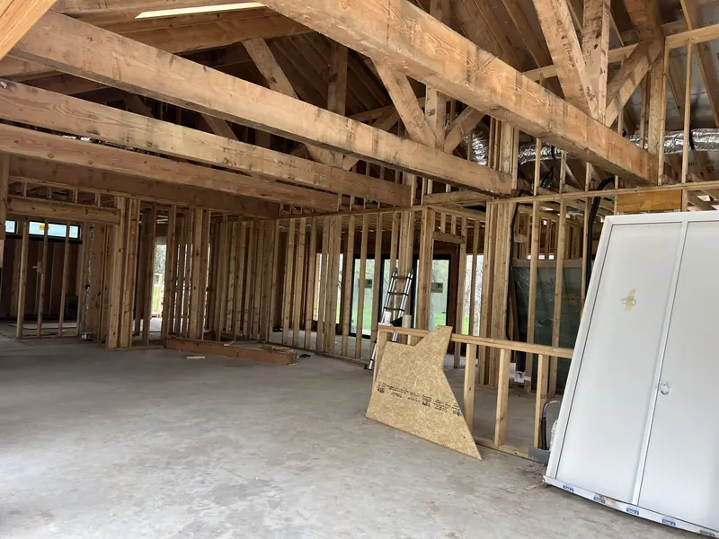 Interior framing and drywall repair in progress during a damage restoration project