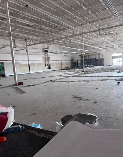 Cleared retail unit looking toward the rear service area after demolition