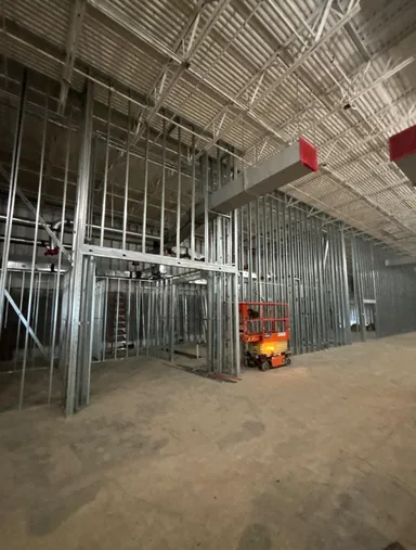 New steel stud partitions framed out inside the cleared unit