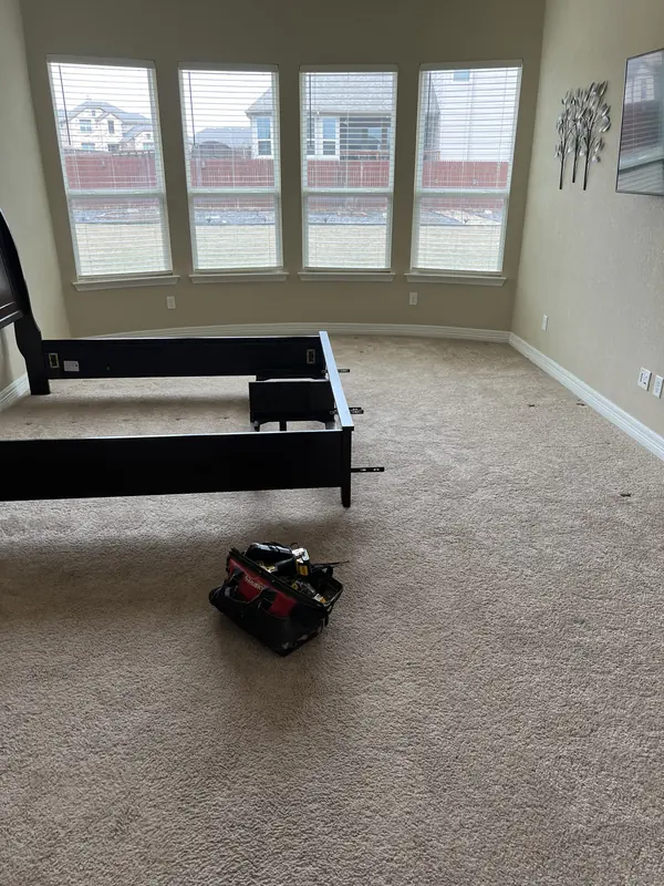 Carpet installed in a two storey living room with tall windows