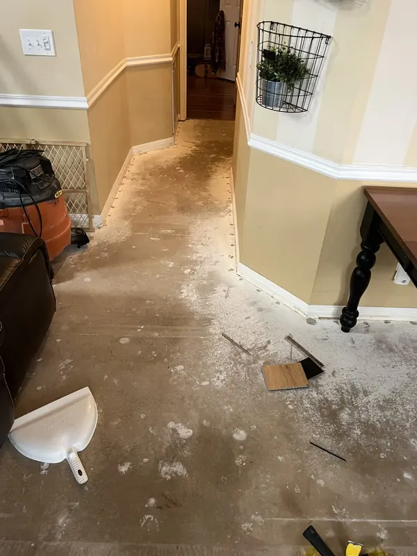 Flooring installation in progress in an entry hall